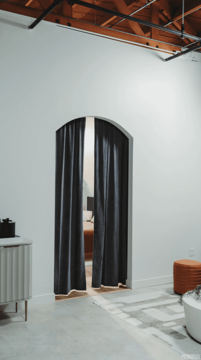 Dramatic arched entrance with flowing curtains for fashion and portrait photography — GMA Creative House studio LA