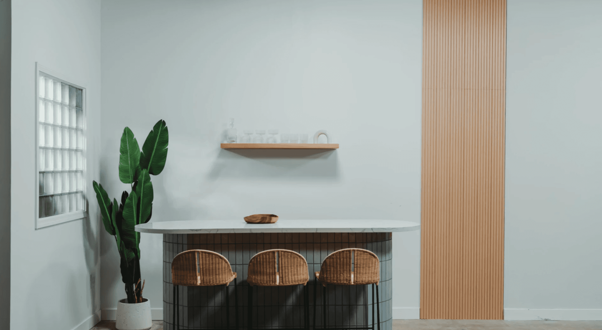 Bar and lounge set with sage walls and curved tile bar for food and beverage photography — GMA Creative House LA